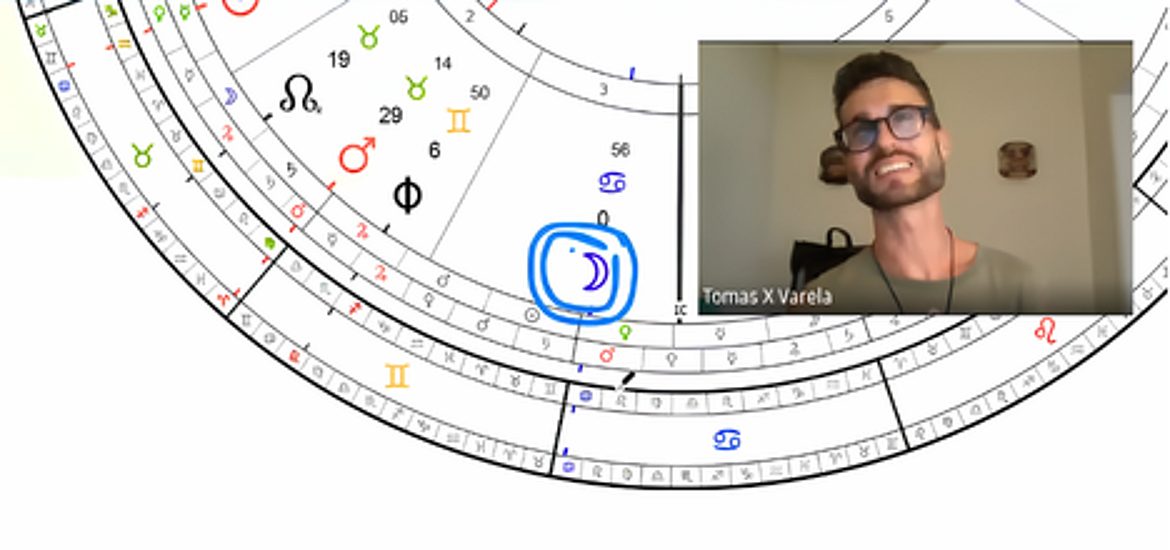 Tomás reading a natal astrology chart in a live session